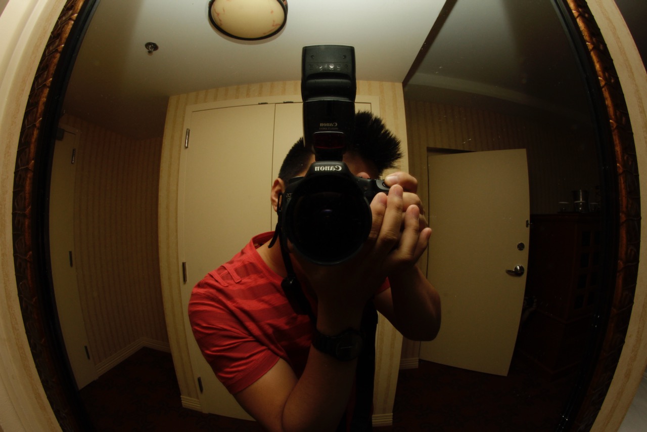 accessibility description: a photo of vincent taking a picture of himself in a mirror with a fisheye lens. the camera is close, covering his face